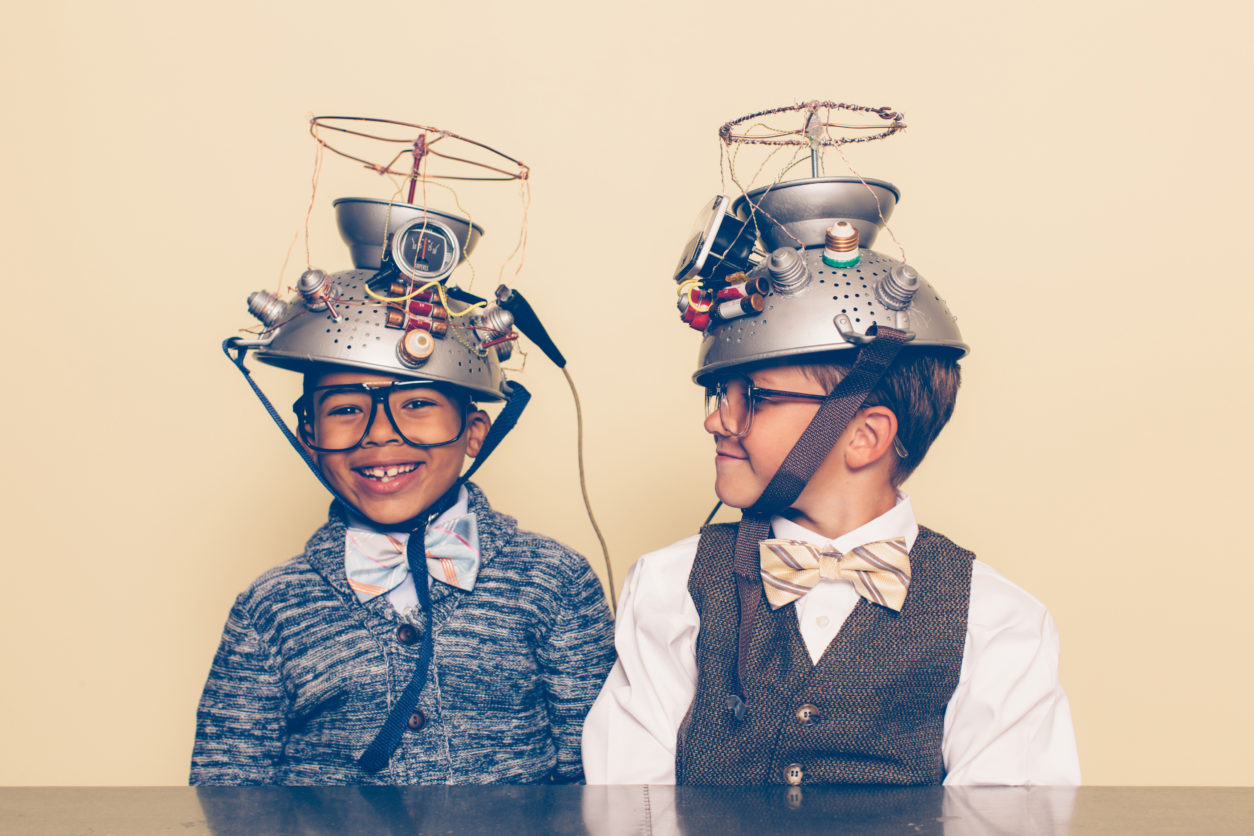 Two Boys Dressed as Nerds Smiling with Mind Reading Helmets