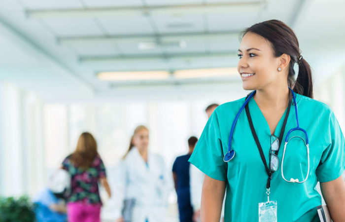 Nurse walking down hallway