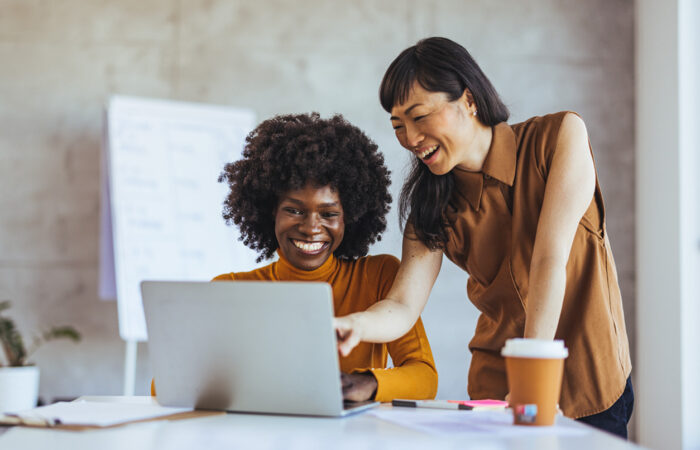 Two people collaborating on a CRM project