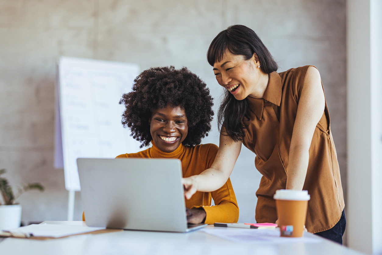 Two people collaborating on a CRM project