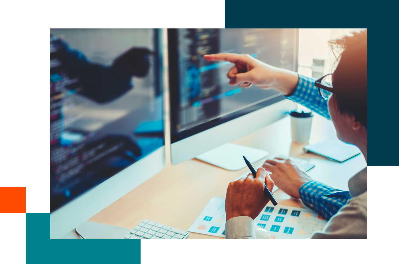 Person pointing at computer screen