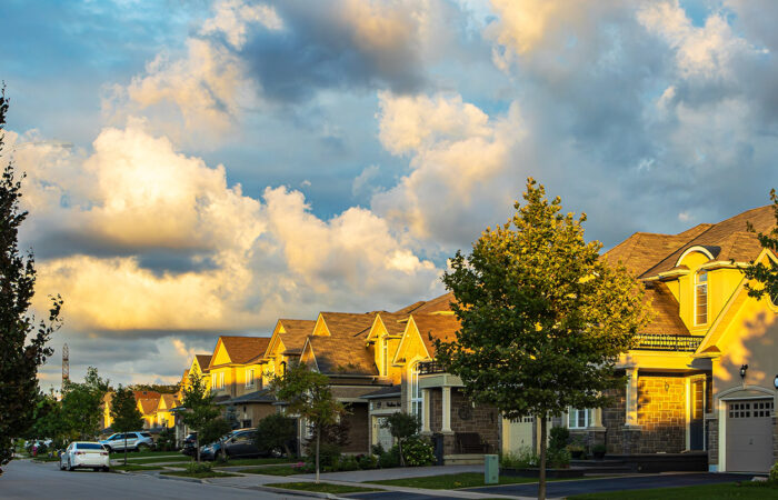Suburban street with lots of clouds in the sky