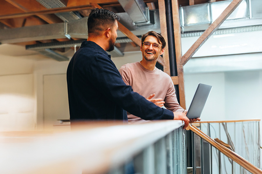 two people discussing the role of tech in their business