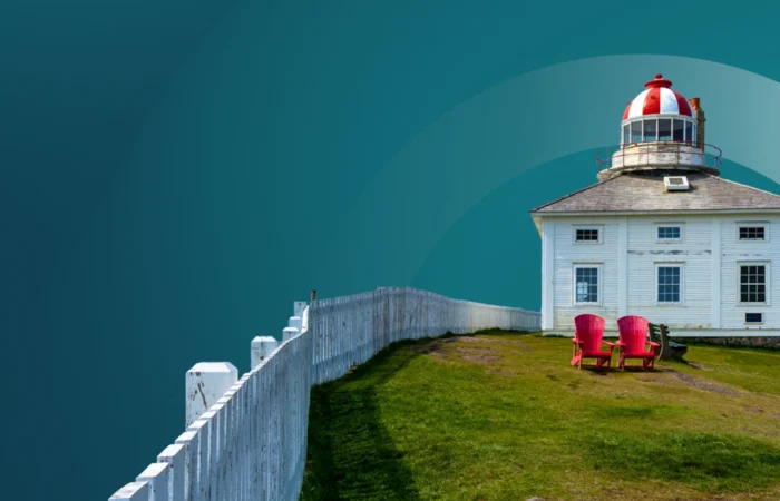 lighthouse with a white picket fence