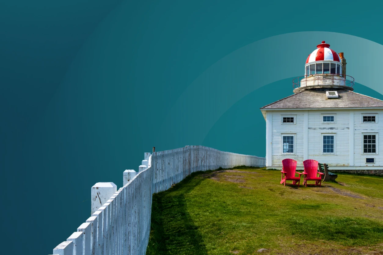 lighthouse with a white picket fence